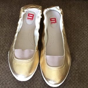 Gold leather flats by 9 west.